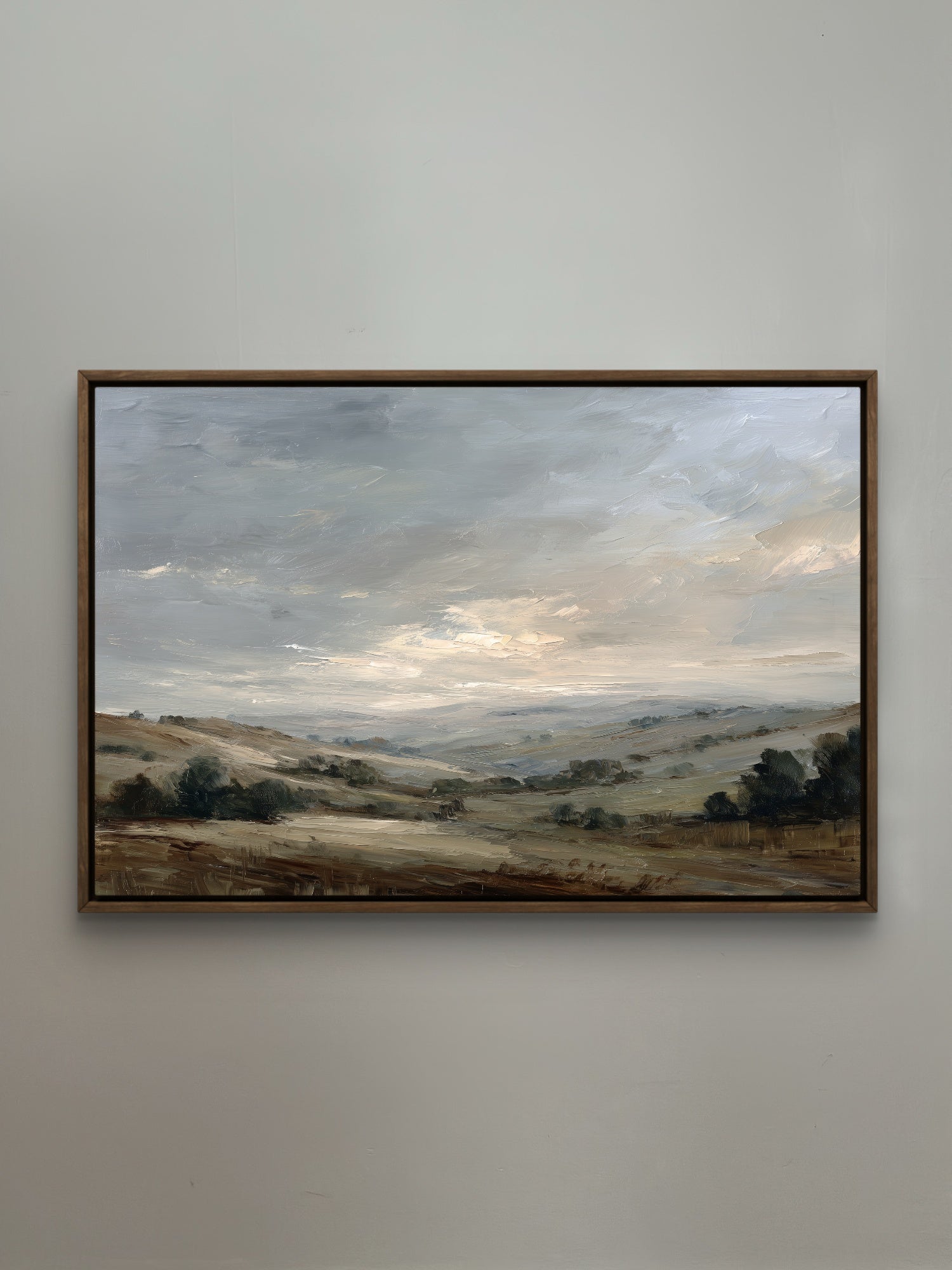 Framed landscape painting on a wall